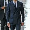 Elegant men's 3-piece suit featuring a double-breasted blazer, vest, and pants, perfect for weddings and business events.