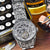 Gala scene featuring the Timepiece of Triumph, accentuating its luxury and craftsmanship.