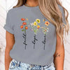 Floral print women's tee featuring 'Faith Hope Love' message, perfect for casual wear and stylish everyday outfits.