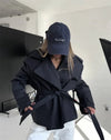 Classic beige trench coat with belt and structured collar for spring