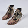 Mid-calf boots with artistic floral embroidery, lace-up front, and stable block heel