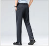 Black stretch pants with sophisticated drape paired with leather dress shoes