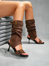 Versatile denim and suede boots with buckle detailing and slip-on design