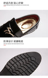 Stylish pointed toe of men's dress shoes in glossy patent leather.