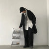 Chic Japanese vintage trench coat for men in black, featuring a single-breasted closure and stylish turn-down collar.
