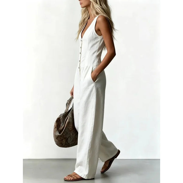 Effortless Escape denim jumpsuit featuring flattering V-neckline and flowing wide leg silhouette