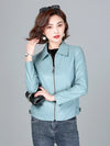 Chic women's sheepskin leather jacket with zippered front, turn-down collar, and pockets for stylish autumn layering.