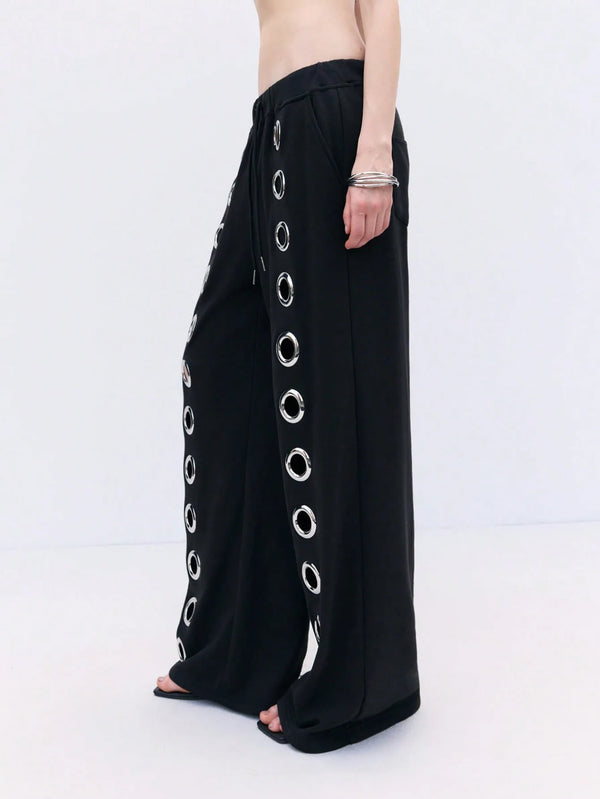 Gender-neutral drawstring pants with Y2K hollow accents and ankle-length cut for versatile street fashion