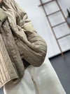 Khaki quilted cotton jacket styled with jeans for casual autumn outfit inspiration