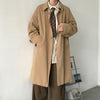 Chic Japanese vintage trench coat for men in black, featuring a single-breasted closure and stylish turn-down collar.