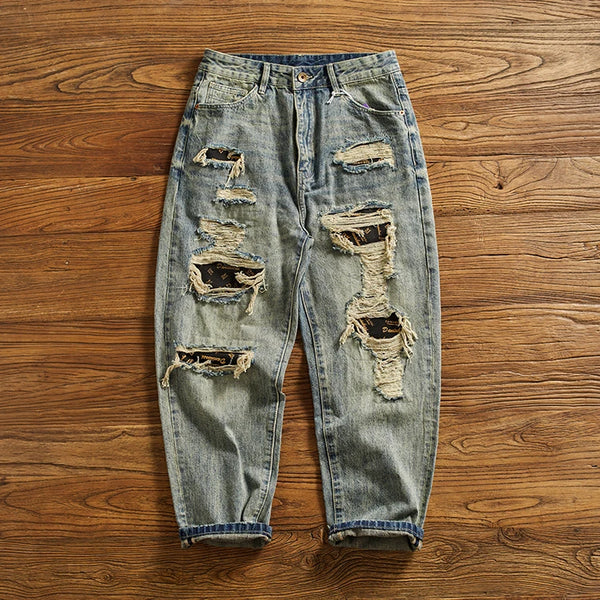 Rebel Spirit Distressed Jeans with a casual belt, emphasizing timeless denim style.