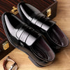Close-up of black brogue detailing on elegant men's oxfords.
