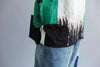 Elegant summer top in soft white linen, perfect for brunch.