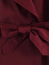 Women's classic trench featuring waist belt and sophisticated collar