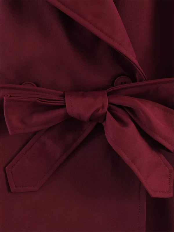 Women's classic trench featuring waist belt and sophisticated collar
