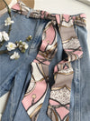 Chic fabric belt for women with geometric design, versatile for dresses, jeans, or as a scarf and headband accessory.