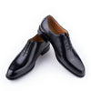 Handcrafted leather dress shoes featuring breathable construction and cushioned insole