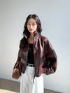 Chic vintage leather cropped jacket for women with a modern fashion twist.