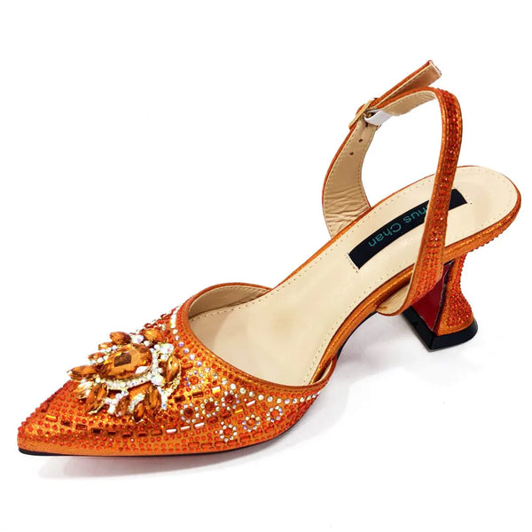 Embellished high heel sandals with crystal detailing and square heel on white background