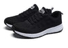 Breathable white sports footwear with colorful trim and cushioned sole