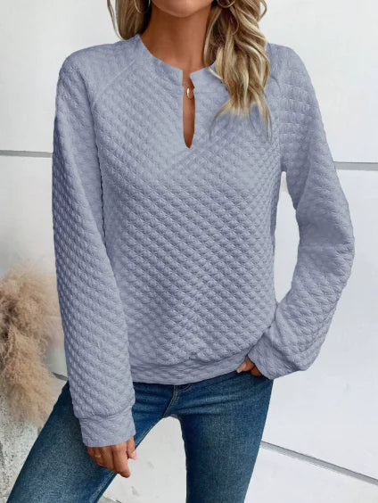 Effortless casual hoodie featuring deep V-neck and loose fit