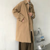 Chic Japanese vintage trench coat for men in black, featuring a single-breasted closure and stylish turn-down collar.
