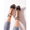 Lace-up elegant stiletto sandals perfect for formal events.