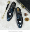 Black leather Oxfords displayed on a polished surface for elegance.