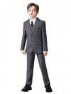 Flat lay of the boys' colorful formal suit set with all pieces arranged neatly.
