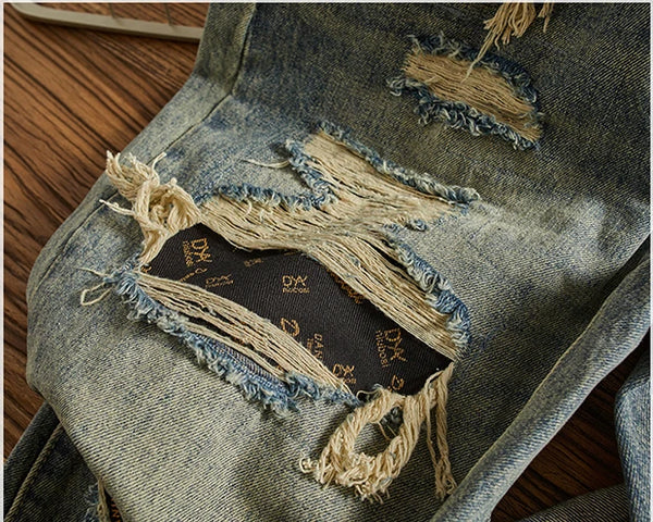 Rebel Spirit Distressed Jeans on a model in an outdoor setting, perfect for adventure wear.