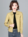 Chic women's sheepskin leather jacket with zippered front, turn-down collar, and pockets for stylish autumn layering.