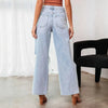 Model wearing trendy ripped ankle jeans, showcasing casual chic summer style.