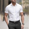 Flat lay of short sleeve business shirt displaying solid pattern and professional design