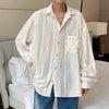 Men's Hollow Out Mesh Long-Sleeve Shirt in black and apricot, featuring breathable fabric and tailored fit for stylish comfor