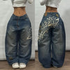 Embroidered denim jeans showcasing urban artistry and self-expression.