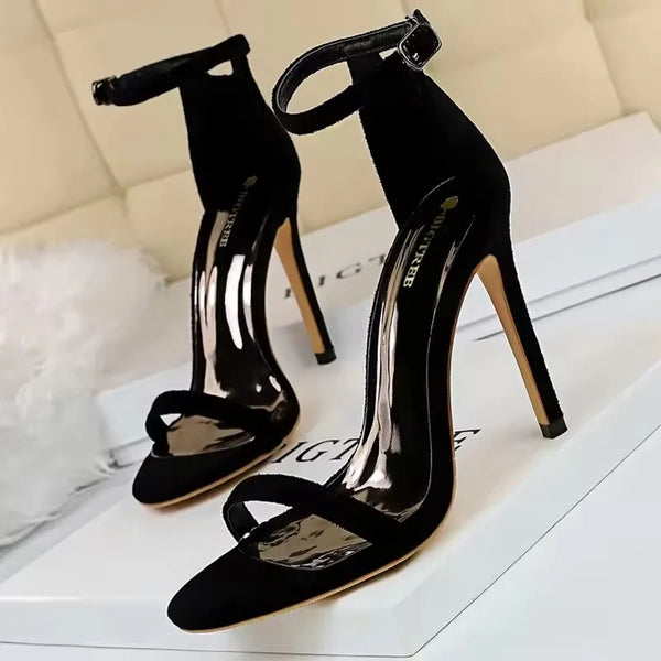 Women's stiletto sandals featuring artistic cutout pattern