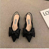 Casual flat sandals with pointed silhouette and feminine butterfly knot in neutral tone