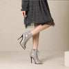 Sophisticated snake-print stiletto boots for evening wear and parties