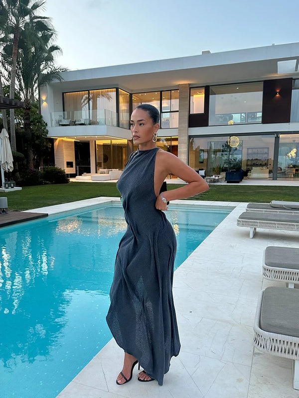 Elegant pullover halter dress featuring flattering ruched detailing and asymmetrical shape
