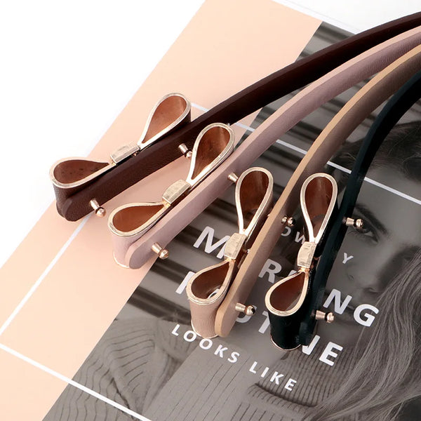 Elegant women's belt with bow detail in premium faux leather, perfect for casual and formal outfits. Stylish and versatile ac