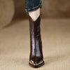 Modern patent leather booties with metal accents and square toe silhouette