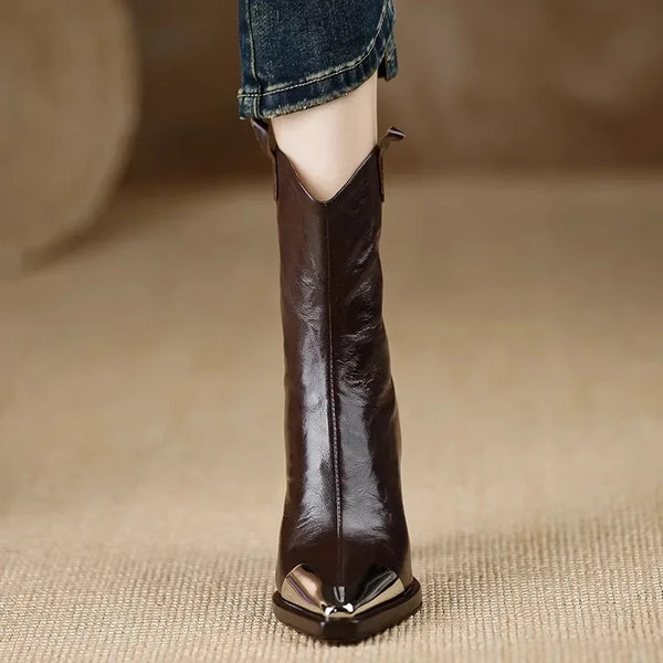 Modern patent leather booties with metal accents and square toe silhouette