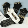 Lightweight designer ankle socks in a modern geometric pattern, ideal for any occasion.