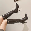 Stylish waterproof stiletto boots featuring a metal buckle detail.