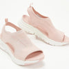 Close-up of breathable mesh upper construction on wedge sandals with back strap