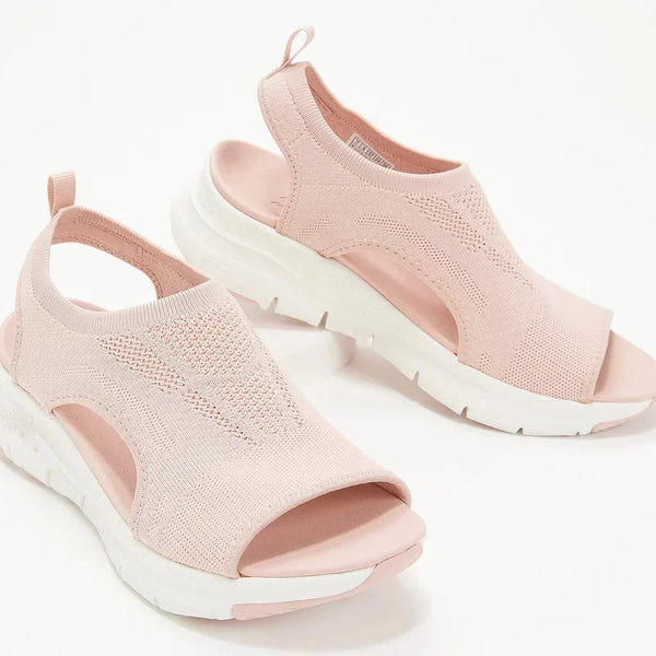 Close-up of breathable mesh upper construction on wedge sandals with back strap