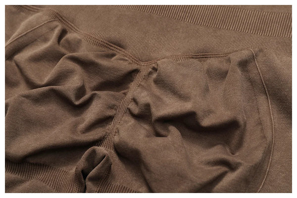 Sand beige ankle-length yoga leggings with elastic waistband.