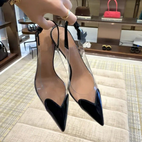 Clear PVC stilettos featuring pointed toe and buckle closure