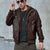 Men's autumn winter PU leather moto jacket with detachable hood, mandarin collar, and zippered accents for stylish comfort.