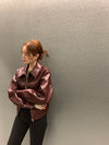 Chic cropped leather jacket for women in premium faux leather, perfect for autumn and winter streetwear fashion.